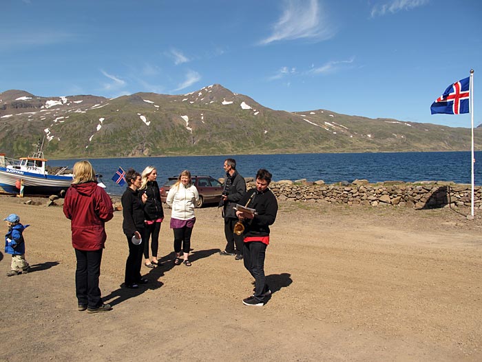 Djúpavík. Music III: Margrét S. (Magga), the national holiday. - Gathering for the pageant, Magga plays saxophone. (17 June 2010)