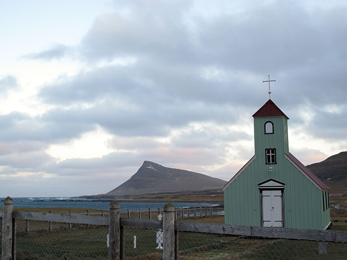 Djúpavík. Finally back in Djúpavík but driving very next to the north! - The church, the old one with the graveyard, of Árneshreppur. In the background Reykjarneshyrna mountain. (31 December 2010)