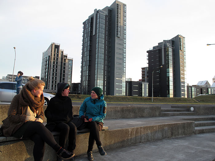 Reykjavík. Where is this bottle now? - Reykjavík Skyline. Infront the skyline sit Elisabeth, Brit and Ulrike. (8 May 2011)