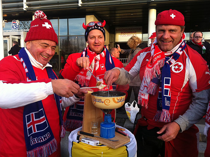 Reykjavík. Soccer game Iceland vs Switzerland. - Fans from Switzerland having fun. And good a good meal - Cheee Fondue. (16 October 2012)