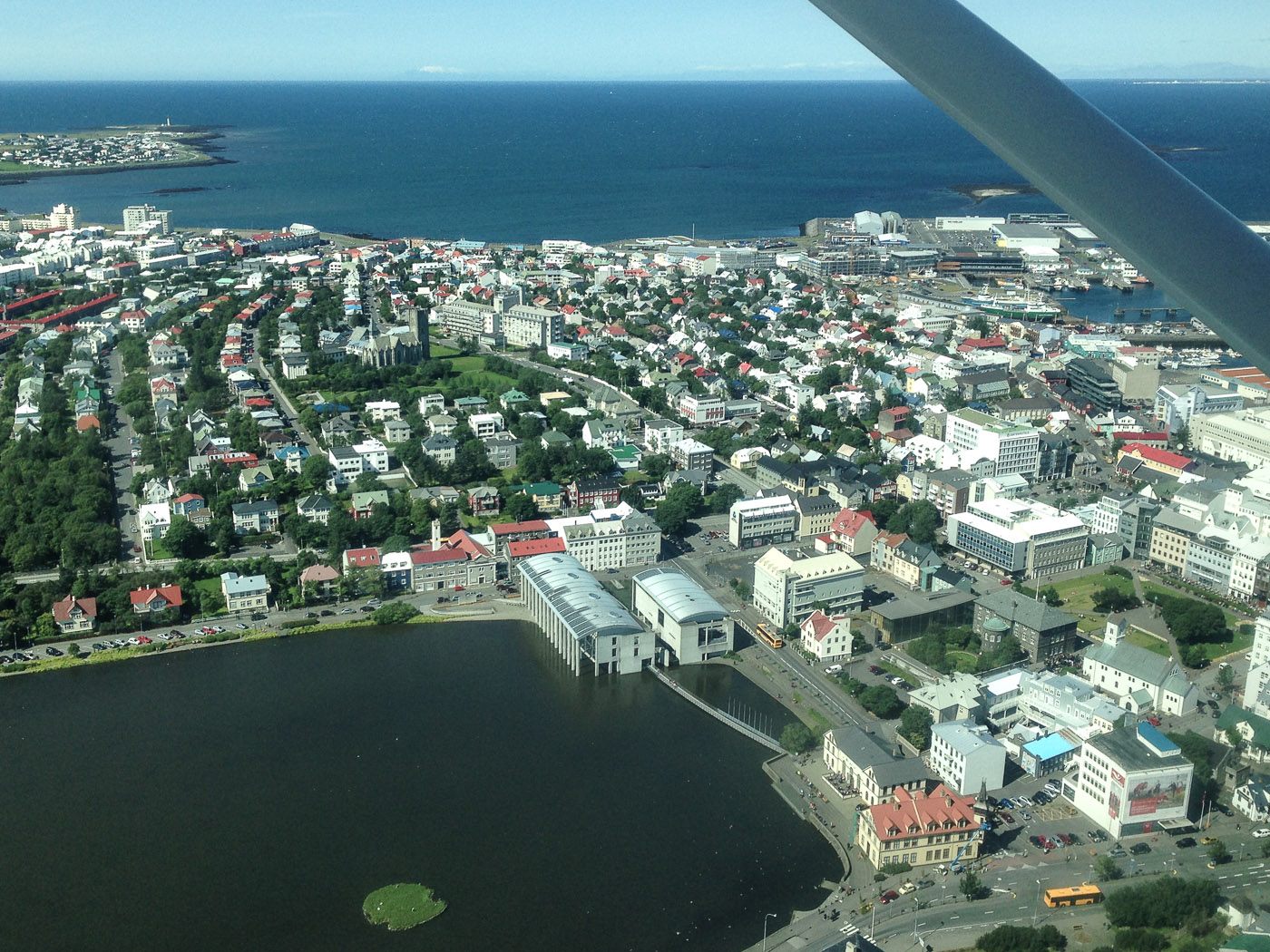 Reykjavík to Djúpavík. A flight ... - Tjörnin lake, townhall and the Parliament Of Iceland. (30 July 2014)