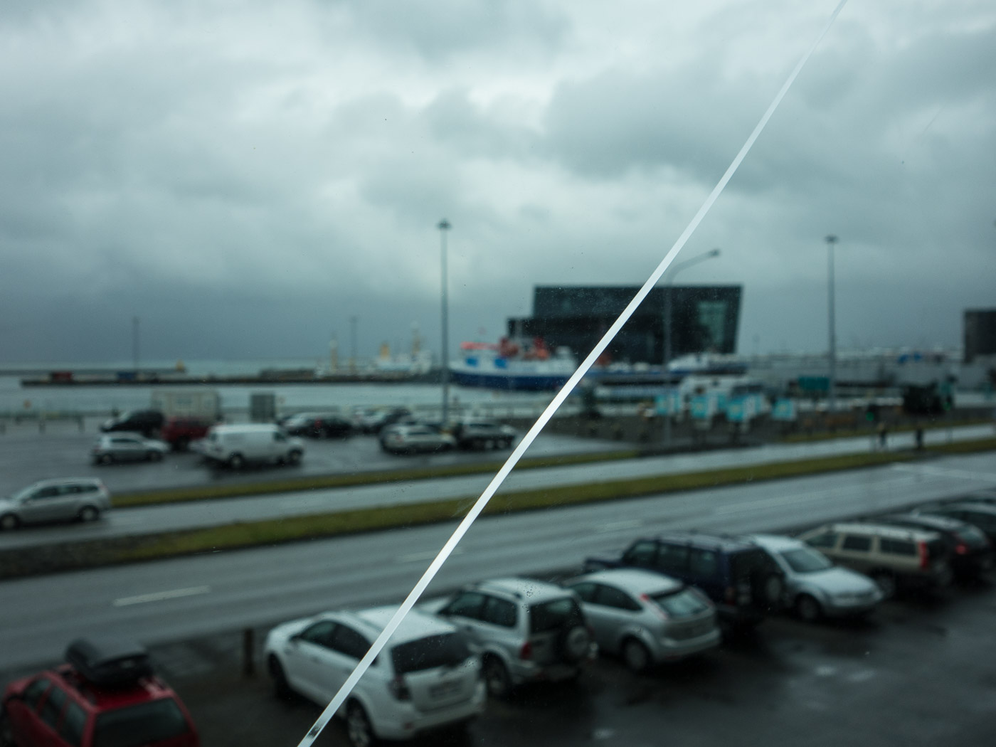 Reykjavík. Miscellaneous LXXIX. - View to <a href='http://www.harpa.is' target='_blank' class='linksnormal'>HARPA</a> (not in clouds) and mountain Esja (in clouds). (4 till 24 September 2014)